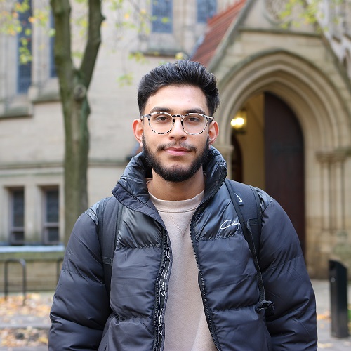 Photo of Hamza in front of the John Owens building.