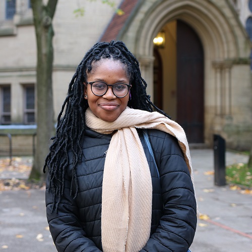 Photo of Aminat in front of the John Owens building.