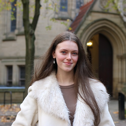 Photo of Ella in front of the John Owens building.