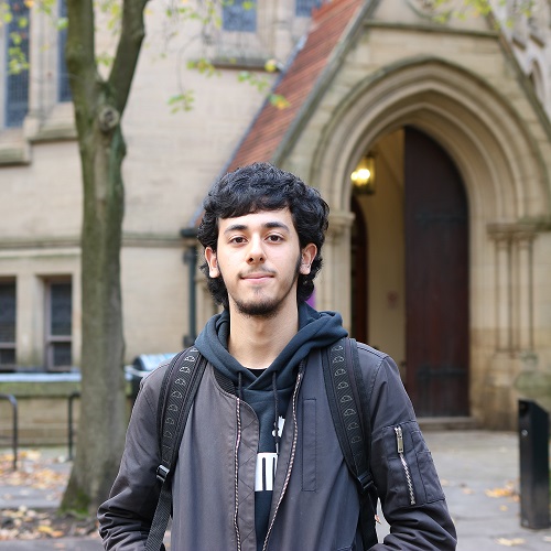 Photo of Haris in front of the John Owens building.
