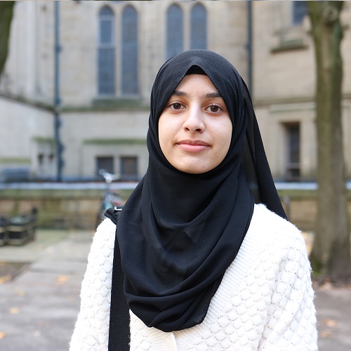 Photo of Namal in front of the John Owens building.